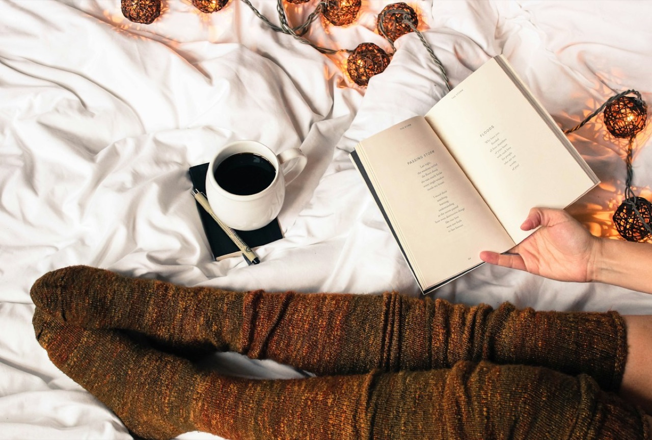 A book and coffee in a quiet reading corner